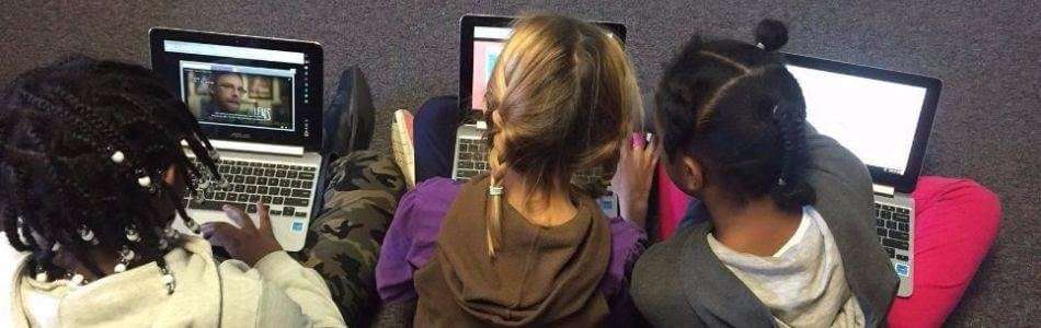 Kids using one-to-one chromebooks